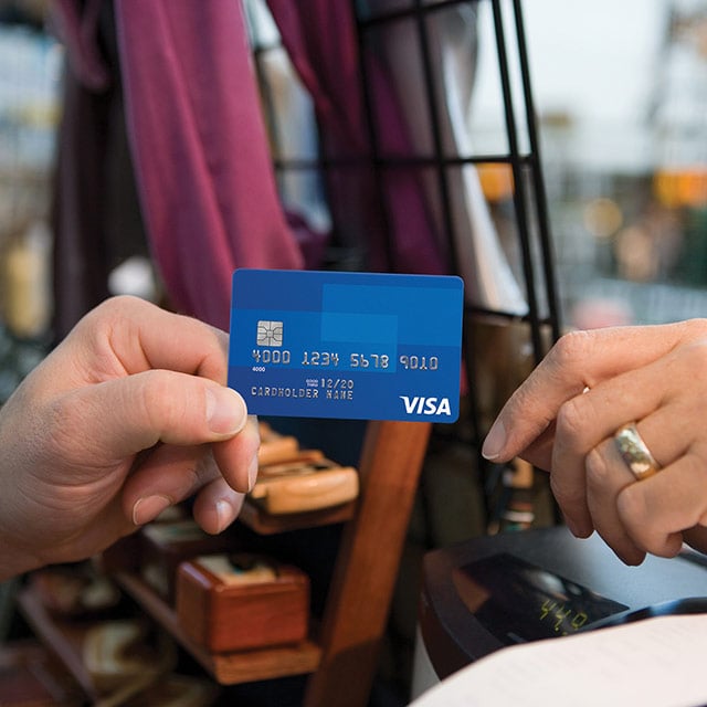 Customer making a secure purchase with a Visa EMV chip card